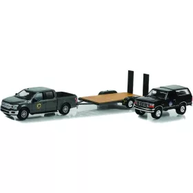   Greenlight - Hollywood Hitch & Tow Series 11 - Yellowstone (2018-Current TV Series) - 2018 Ford F-150 Montana Livestock Association with 1992 Ford Bronco Montana Livestock Association on Flatbed Trailer - Evergreen